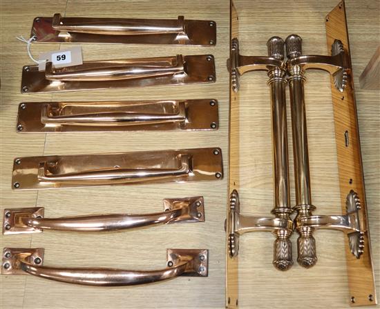 Four pairs of cast brass door handles